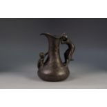 ETAIN GARANTI, FRENCH ART NOUVEAU MOULDED AND EMBOSSED PEWTER JUG, of baluster form with waisted