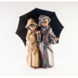 LLADRO FIGURE IN BISCUIT FINISH of a boy and a girl beneath an umbrella 9 1/4" (25cm) high