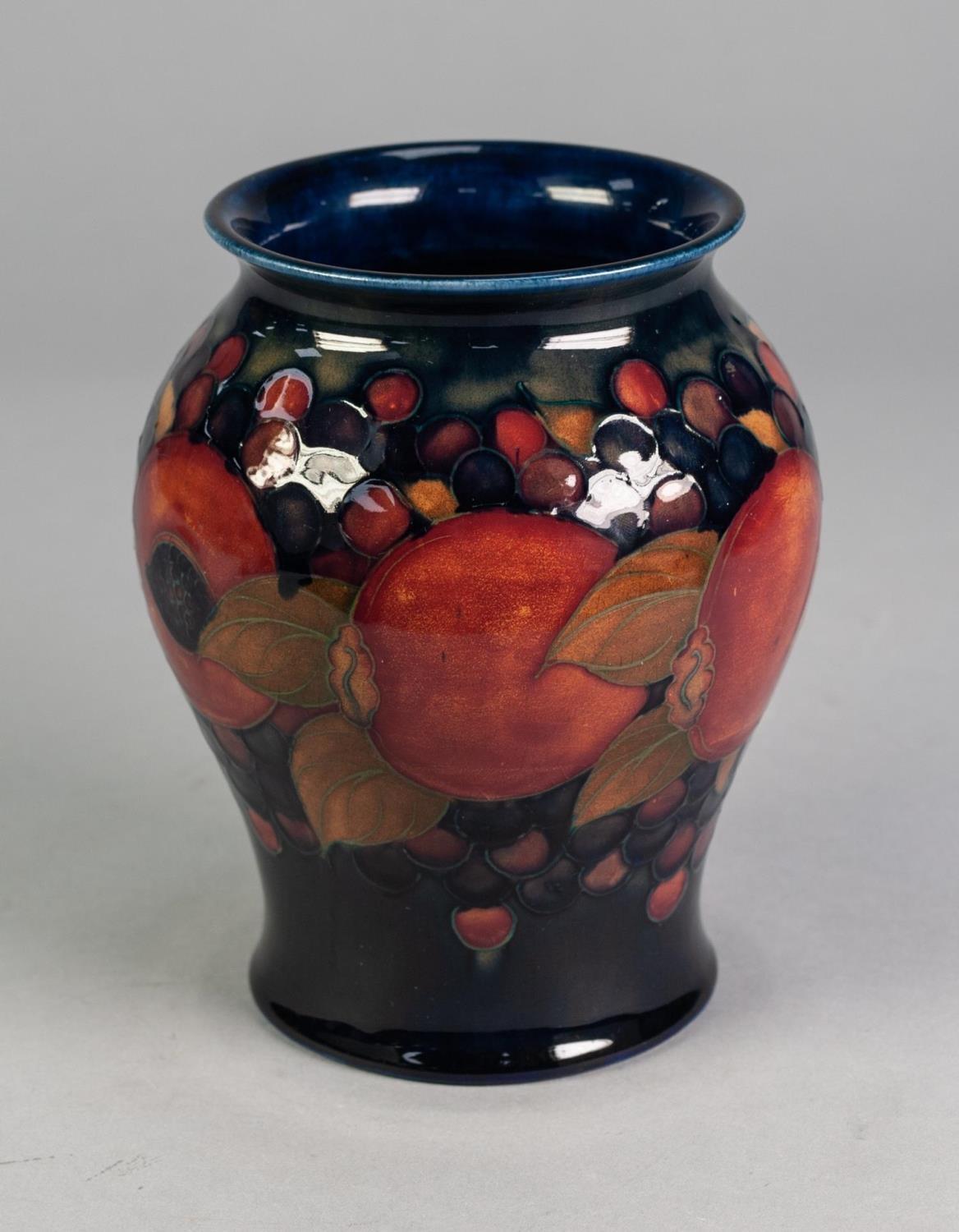 WILLIAM MOORCROFT POTTERY INVERTED BALUSTER SHAPE VASE, pomegranate and berry decorated, on a dark - Image 3 of 4