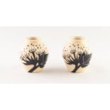 MODERN MOORCROFT PAIR OF ?SUMMER SILHOUETTE? MOULDED POTTERY MINIATURE VASES, each of ovoid form,