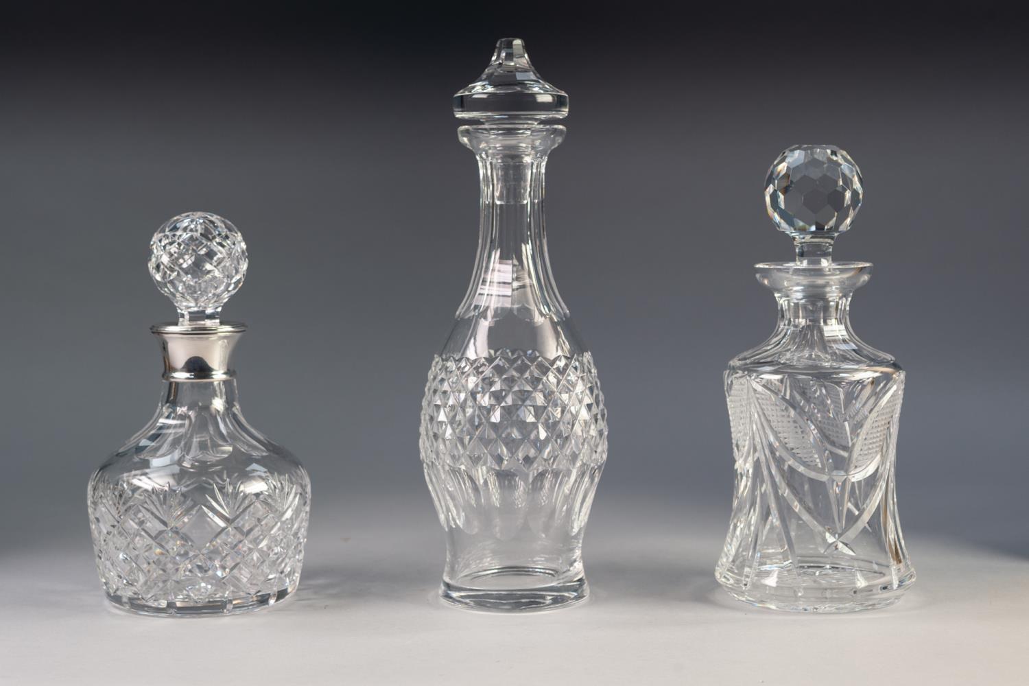 THREE MODERN CUT GLASS DECANTERS with stoppers, one with a silver collar hallmarked Birmingham 1996