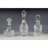 THREE MODERN CUT GLASS DECANTERS with stoppers, one with a silver collar hallmarked Birmingham 1996