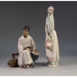 LLADRO PORCELAIN FIGURE OF A YOUNG WOMAN CARRYING A BASKET OF FRUIT, 13? (33cm) high, printed