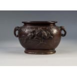 A SMALL MEIJI PERIOD CAST BRONZE JARDINIERE with zoomorphic handles, on each side in relief with two