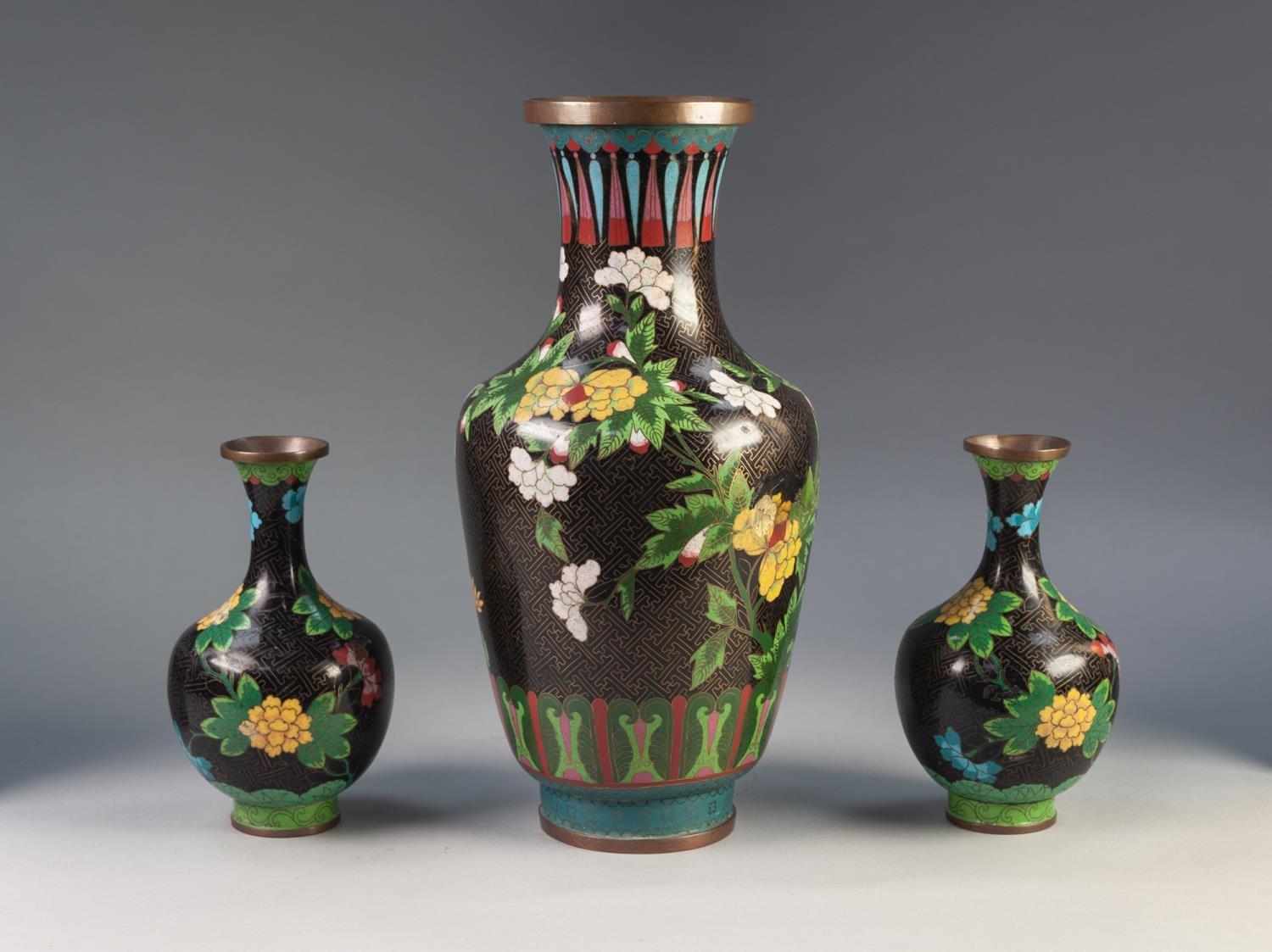 THREE MODERN ORIENTAL CLOISONNÉ VASES, all with floral decoration on a midnight blue ground, set