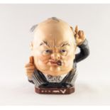 BURLEIGHWARE ?CHURCHILL VICTORY? POTTERY CHARACTER JUG, modelled seated with left arm raised,