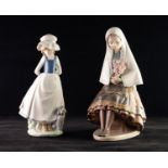 A LLADRO FIGURE OF A SEAT YOUNG LADY, holding a bouquet of roses, 10" (25.5cm), ALSO A NAO FIGURE of