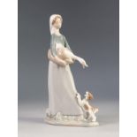 LLADRO PORCELAIN FEMALE FIGURE CARRYING A GOOSE IN A BASKET A PUPPY AT HER FEET 10 1/2" (26.5) HIGH