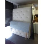 A GOOD QUALITY 5' DRAWER DIVAN AND MATTRESS WITH BLUE FABRIC HEADBOARD