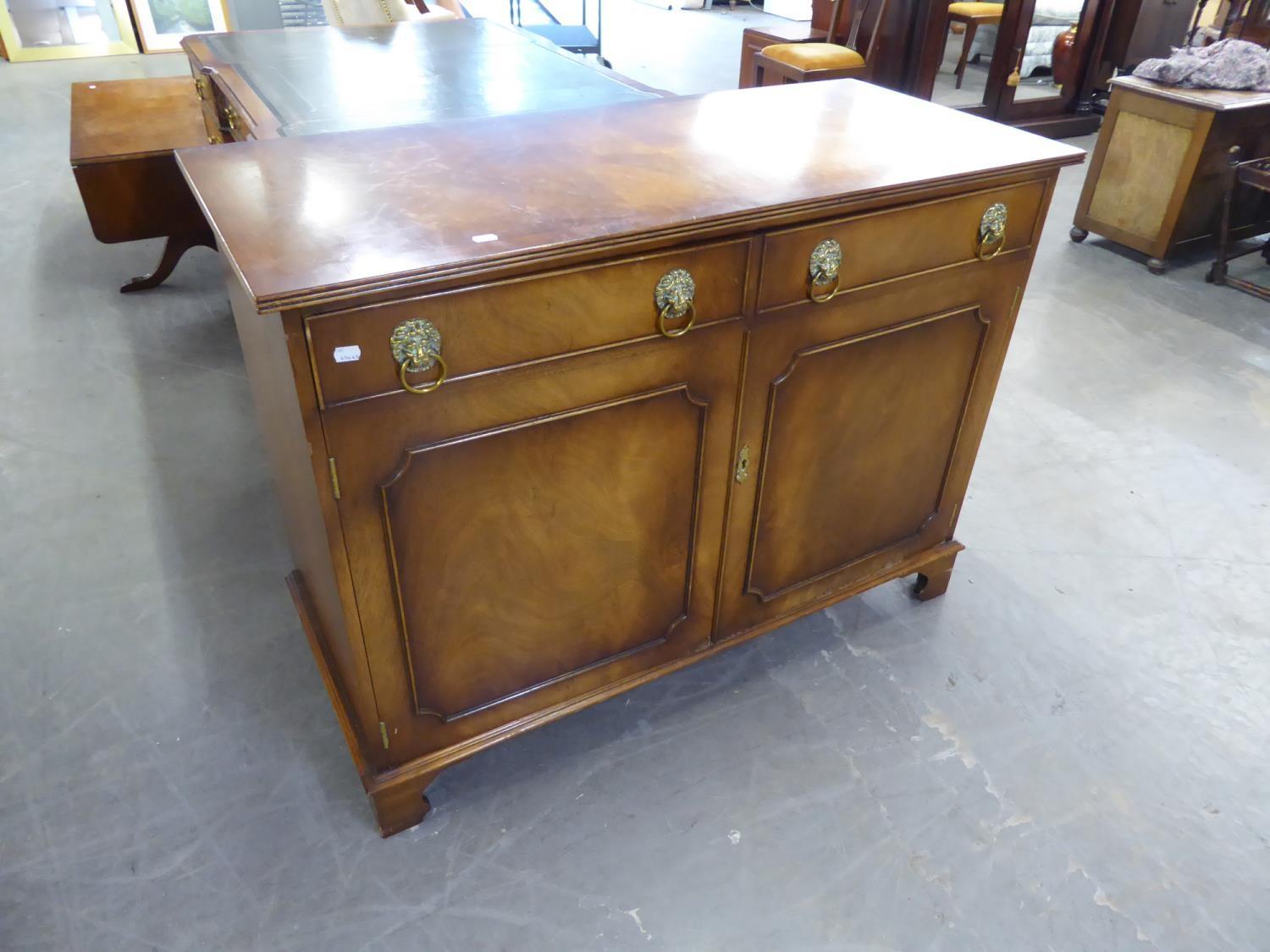 *BEVAN FUNNELL REGENCY STYLE MAHOGANY SIDE CABINET, THE TWO DOORS EACH FACED AS A FALSE DRAWER