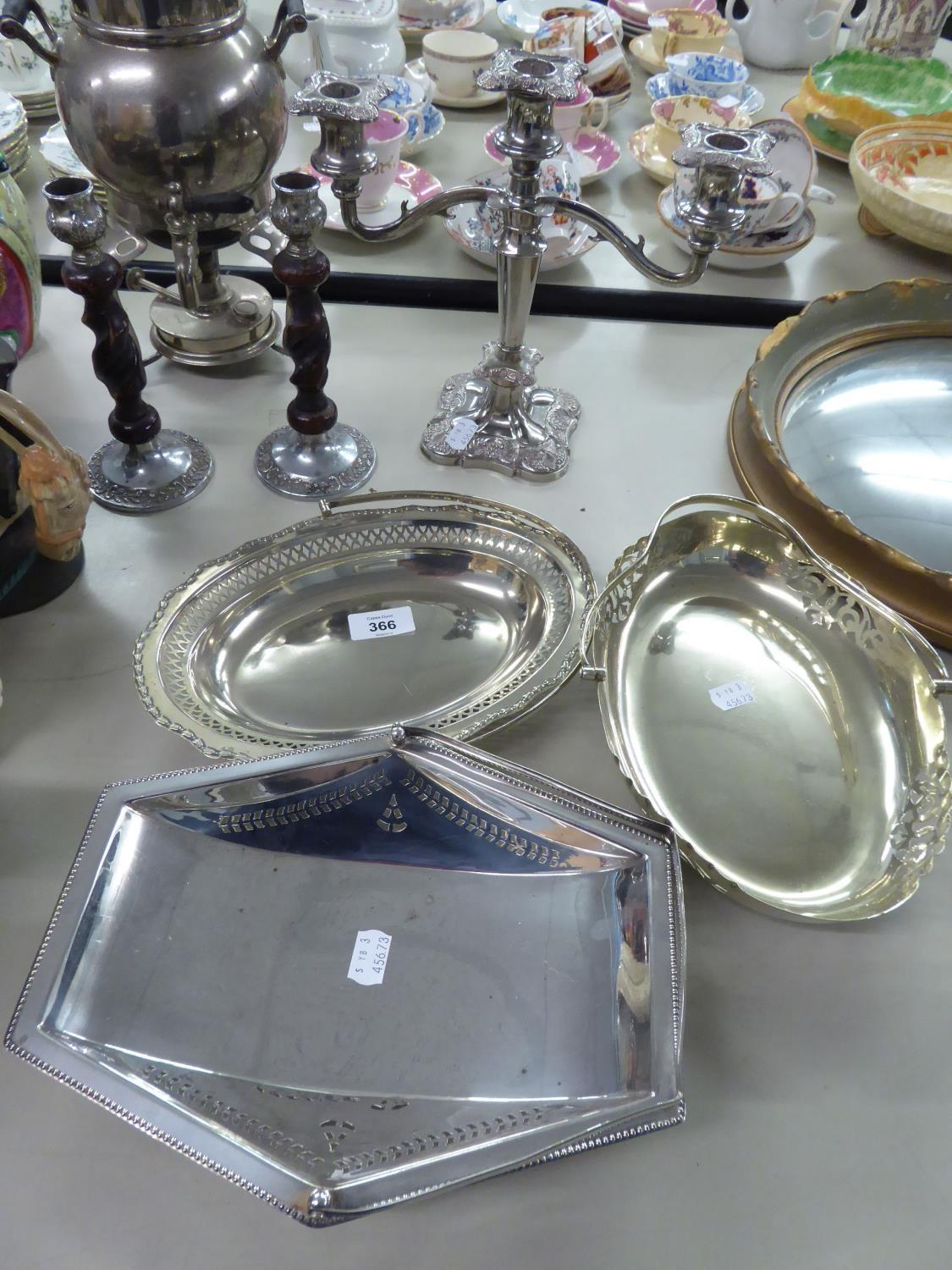 SIX PIECES OF ELECTROPLATE, WHITE METAL WARES TO INCLUDE, CANDLE STANDS, THREE SWING HANDLE DISHES