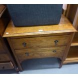 A SMALL OAK TWO DRAWER CHEST