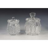 TWO HEAVY QUALITY CUT GLASS BISCUIT CONTAINERS AND COVERS, one of rounded oblong form, the other