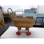 A CHILDS WICKER BASKET ON WHEELS