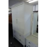A JOHN LEWIS CREAM PAINTED WARDROBE, OVER TWO SHORT AND ONE LONG DRAWER AND A MATCHING LOW