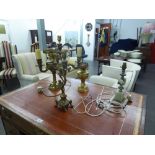 A BRASS FIVE LIGHT CANDELABRUM, TWO BRASS OIL LAMPS AND AN ONYX TABLE LAMP