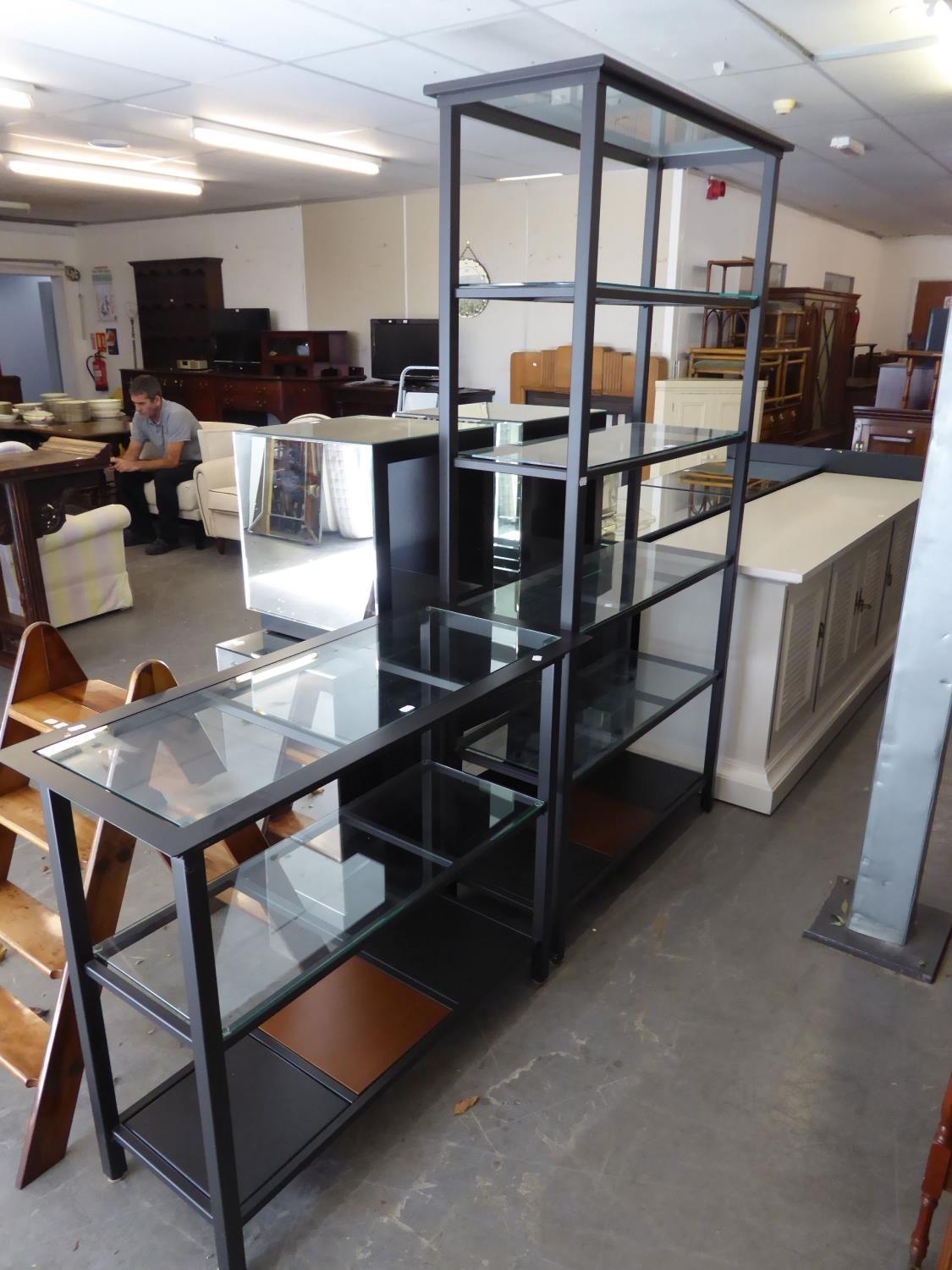 A MODERN METAL FRAMED BOOKSHELF, HAVNG FIVE GLASS SHELVES AND A SMALLER EXAMPLE (2)