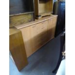 MODERN LIGHTWOOD SIDEBOARD HAVING FIVE CENTRAL DRAWERS BETWEEN CUPBOARD DOORS, CHROME HANDLES