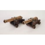 A PAIR OF 20th CENTURY BRASS MAN O' WAR CANNON ON OAK CARRIAGE WITH BRASS WHEELS, THE 7 1/2" LONG