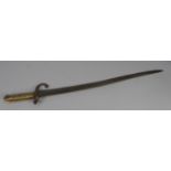 FRENCH, LATE 19th CENTURY SABRE BAIONETTE, the blade and guard badly pitted and having brass hilt