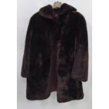 LADY'S BROWN DYED SHEEPSKIN FULL-LENGTH COAT with shawl collar, hook fastening front and a MINK DYED