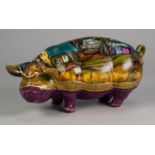 JOCELYNE LAPOINTE, CANADIAN, HAND PAINTED POTTERY PIGGY BANK, modelled standing with head turned