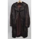 LADY'S DARK BROWN MINK DYED MUSQUASH FULL-LENGTH COAT with broad revere collar, hook fastening front