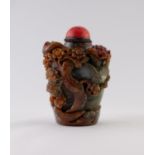 A GOOD CHINESE QING DYNASTY CARVED THREE COLOUR JADE SNUFF BOTTLE the grey-green stone with russet