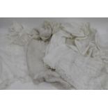 THREE WHITE COTTON CHRISTENING GOWNS with cut and embroidered floral detail (3)