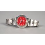 LADY'S OMEGA GENEVE, 'DYNAMIC' WRIST WATCH, with round red dial with batons and centre seconds hand,