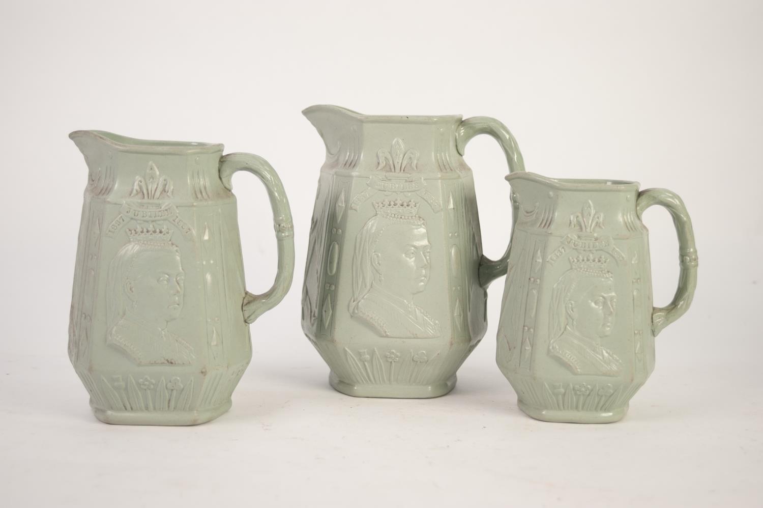 J T DUDSON GRADUATED TRIO OF MOULDED GREEN STONEWARE OCTAGANOL FORM COMMEMORATIVE JUGS with bust