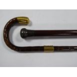 WALKING STICK with gold plated mounts and ANOTHER WALKING STICK with silver pommel (indistinct mark)