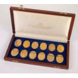 SET OF TWELVE OVAL SILVER GILT MEDALLIONS RELATING TO "THE ARMS OF HRH THE PRINCE ANDREW AND SARAH