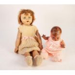 CIRCA 1940s MOULDED COMPOSITION SWIVEL HEADED DOLL with painted features, ball jointed and spring