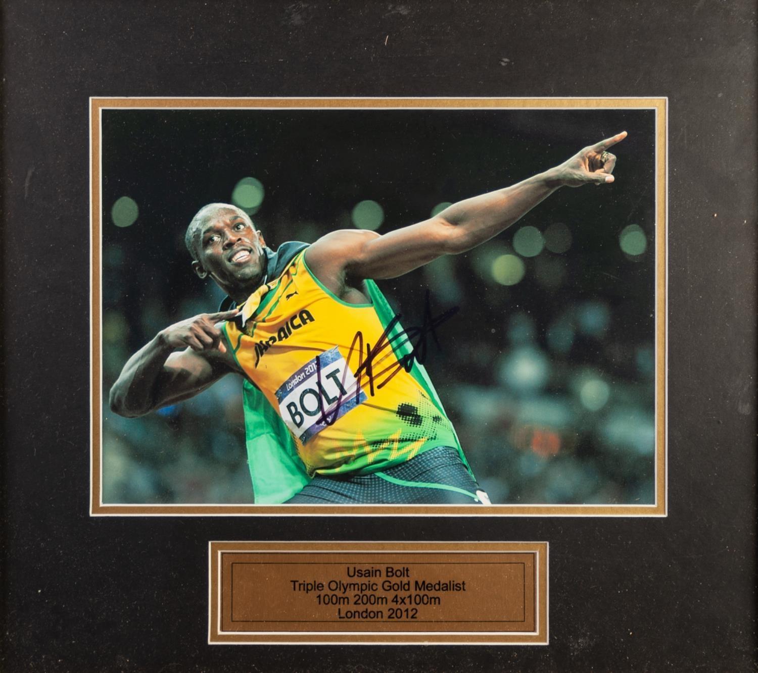 USAIN BOLT SIGNED COLOUR PHOTO taken in typical celebratory pose London Olympics 2012 WITH