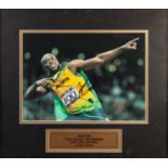 USAIN BOLT SIGNED COLOUR PHOTO taken in typical celebratory pose London Olympics 2012 WITH