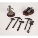 FIVE STEEL MINIATURE MINERS HAMMERS, PICKS AND SHOVEL, A MINIATURE PEWTER FIGURE IN TRICORN HAT, AND