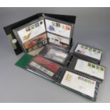 ACCUMULATION TO TWO CARTONS CONTAINING THIRTEEN BINDERS OF GB QE11 FDC?S AND PRESENTATION PACKS .