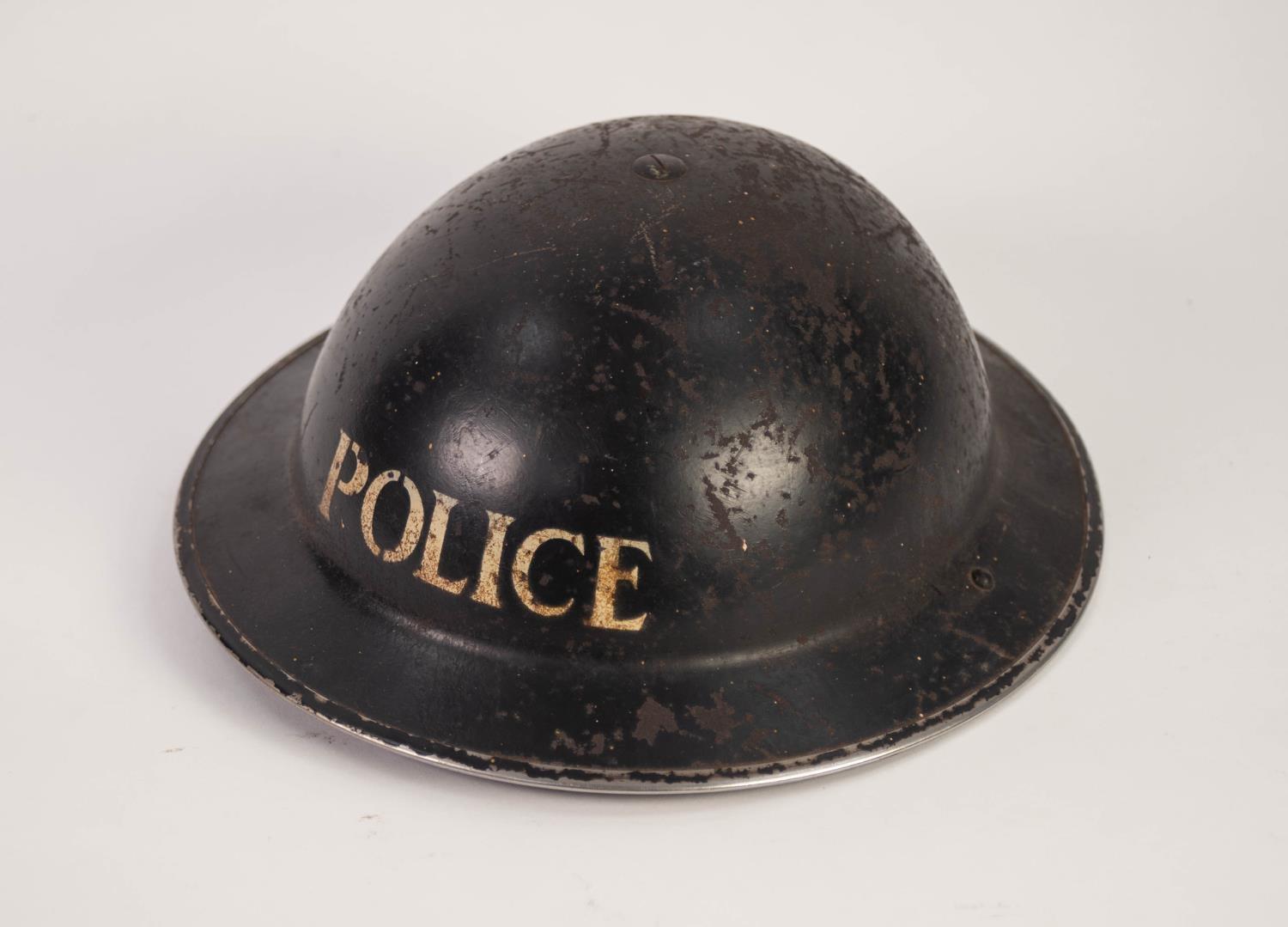 A WWII POLICEMAN'S METAL HELMET