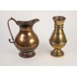 A VERY HEAVY TURNED BRAN VASE, 9" HIGH ALSO AN ANTIQUE COPPER ALLOY BALUSTER SHAPE JUG WITH SCROLL