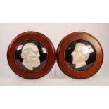 PAIR OF UNUSUAL M0ULDED AND SILK FABRIC CLAD WALL MASKS DEPICTING DISRAELI AND GLADSTONE mounted