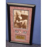 MARILYN MONROE SWATCH OF SILK STOCKING, framed with a reproduction black and white photograph of the