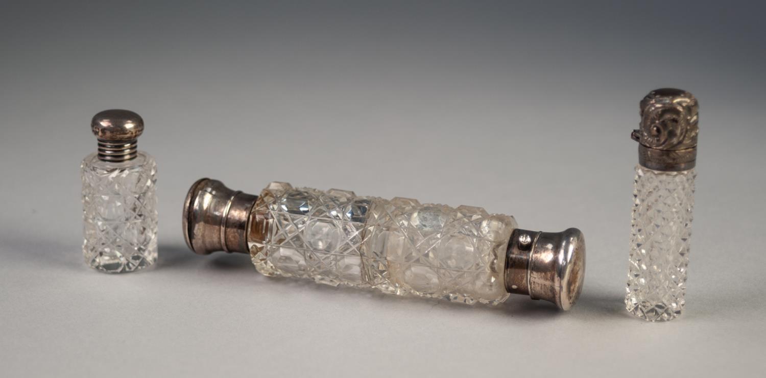 EARLY 20th CENTURY CUT GLASS DOUBLE ENDED CYLINDRICAL SCENT BOTTLE with white metal hinged and screw