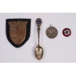 GERMAN WORLD WAR II EMBOSSED BRONZED METAL KUBAN SHIELD mounted on black back cloth together with