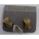 A PAIR OF CHRISTIAN DIOR VINTAGE EARRINGS Each designed as a textured cross in base metal, with clip