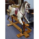 RELKO MEDIUM SIZED HAND CARVED ROCKING HORSE, LATE 20TH CENTURY, white with black painted detail and