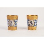 PAIR OF SMALL RUSSIAN GILT METAL AND ENAMEL BEAKERS each incorporating photographic images of famous