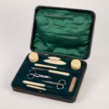 EARLY 20th CENTURY BLACK MOROCCO CASED BONE AND STEEL MANICURE SET