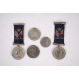 TWO PLATED WHITE METAL MEDALLIONS VICTORIA GOLDEN JUBILEE 1887 each with woven silk ribbons with