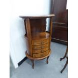 FRENCH STYLE MAHOGANY SMALL OVAL CABINET, WITH OPEN COMPARTMENTS OVER NEST OF FOUR SMALL DRAWERS, ON